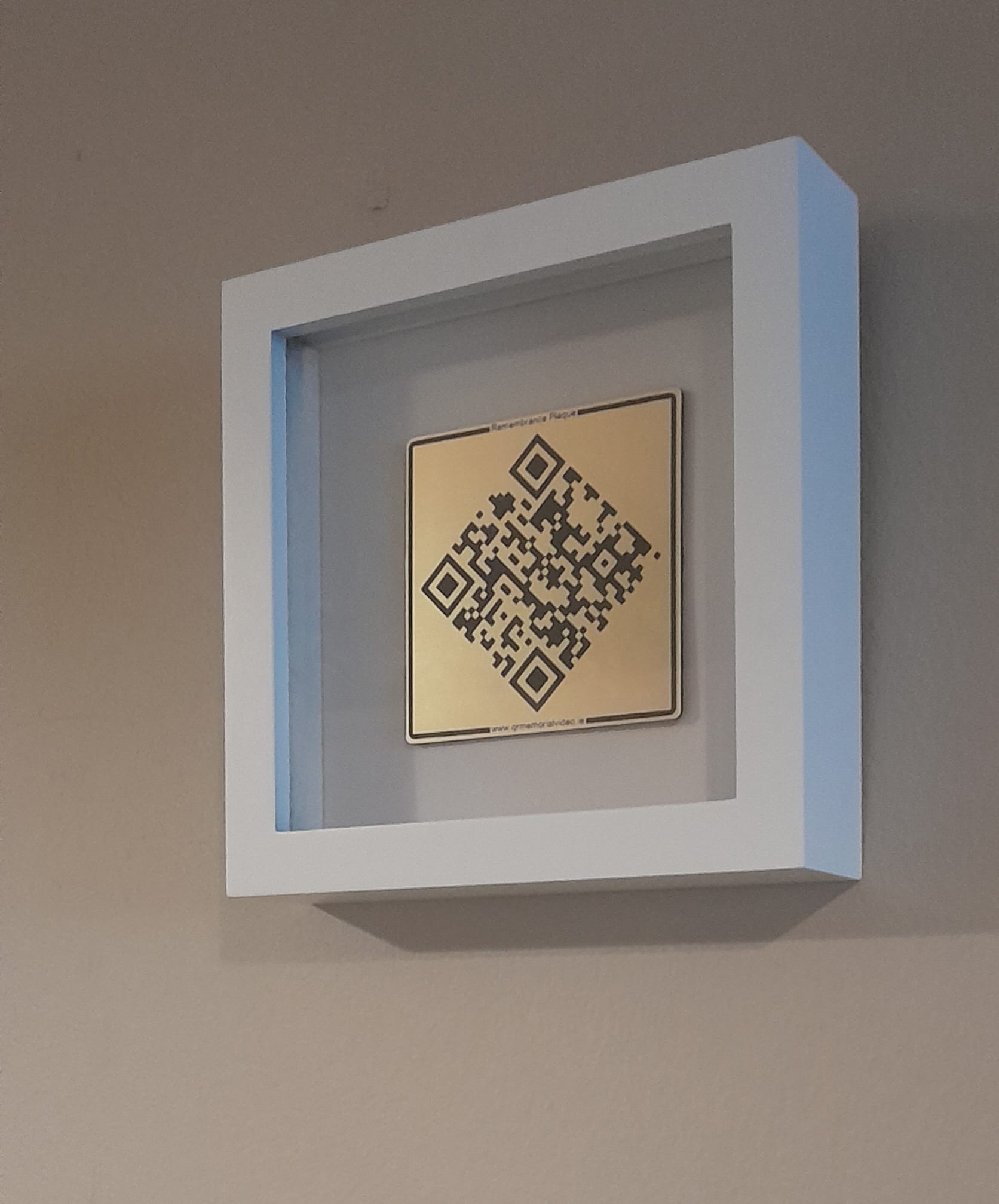 Memorial plaque displayed in a frame